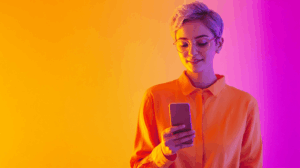 a woman holding a phone