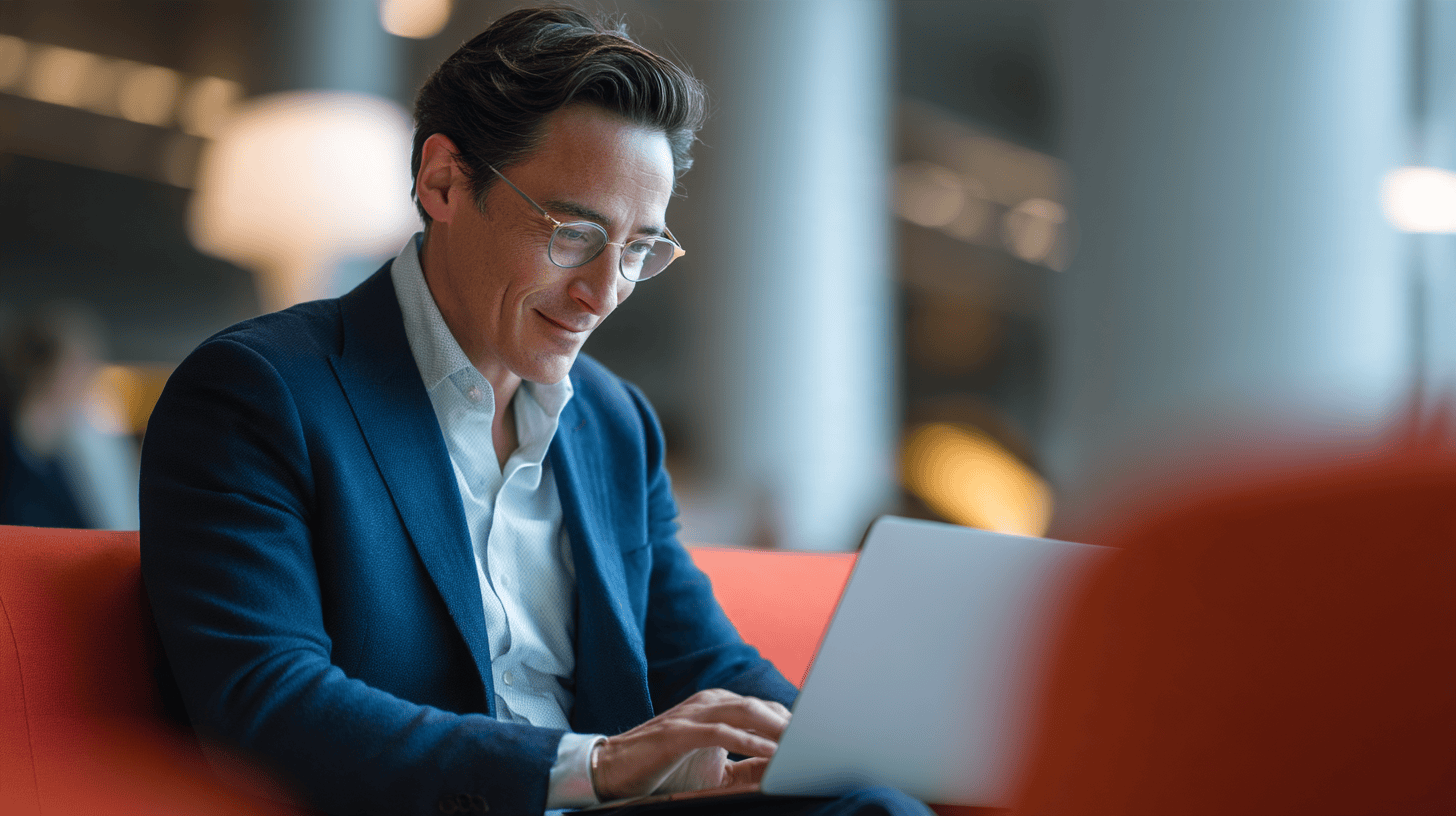Man working on laptop in cafe