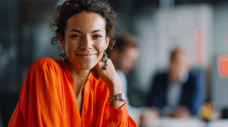 Woman in orange blouse, thoughtful expression.