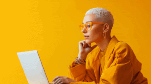 a woman with short white hair and yellow glasses