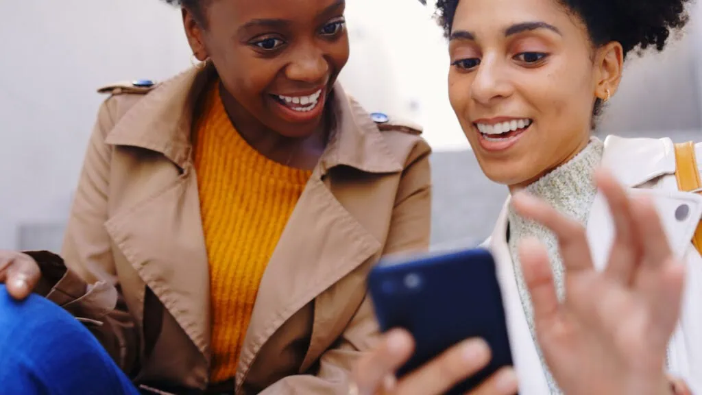 a woman looking at a phone