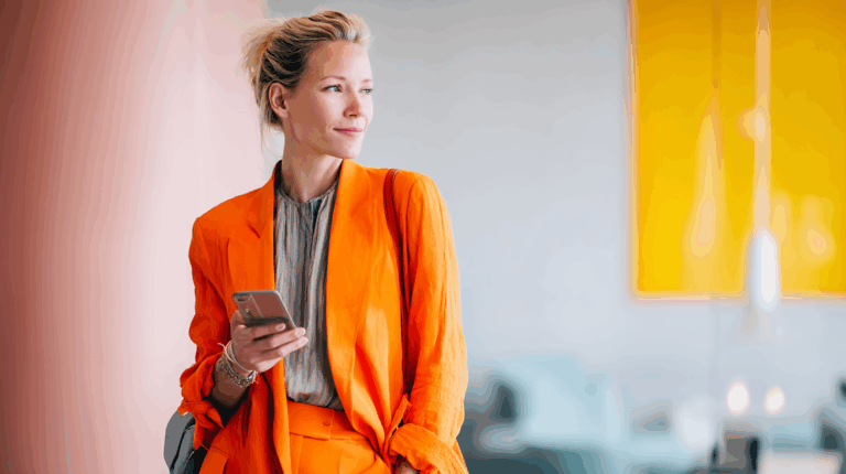 a woman in an orange suit holding a phone
