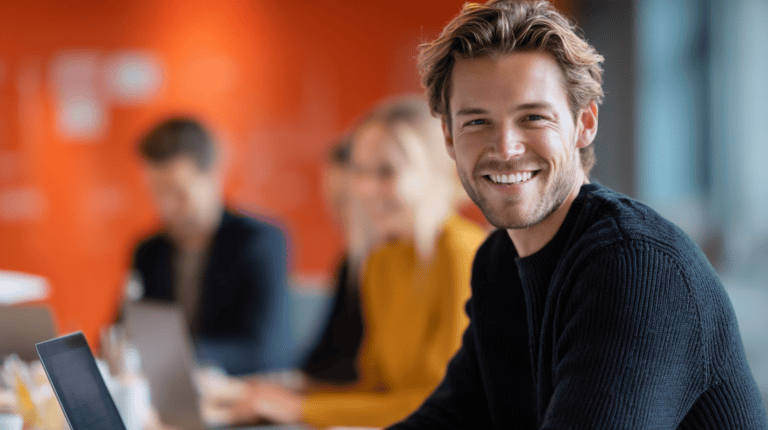 Smiling man in modern office setting.