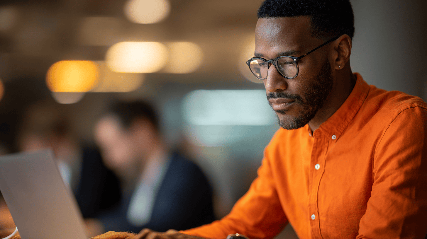 Man working intently on laptop