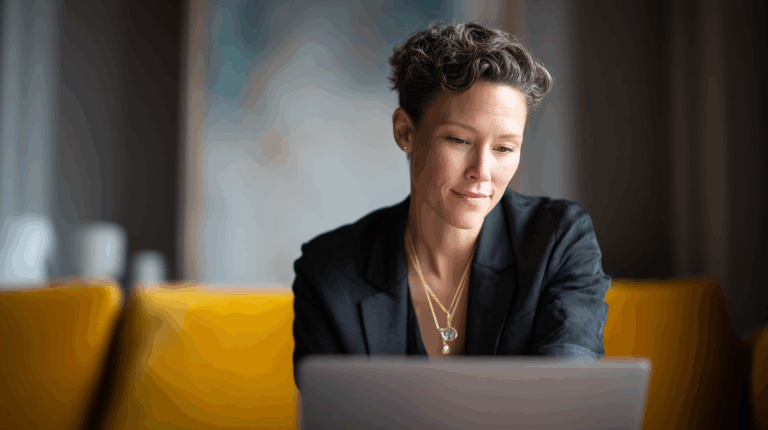 Businesswoman working on laptop in modern office, professional digital marketing, female entrepreneur, remote work, corporate meeting.