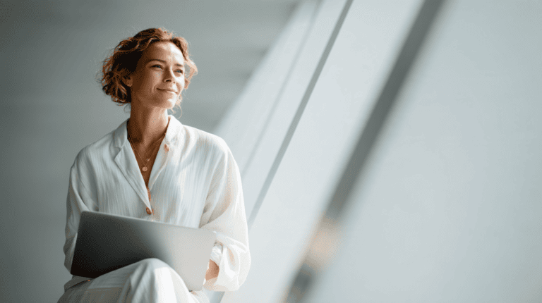 Woman with laptop in bright setting
