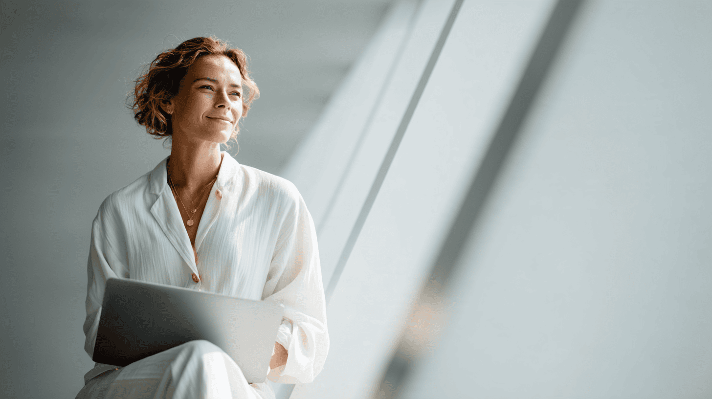 Woman with laptop in bright setting