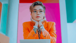 a woman with her hands on her chin